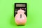 Piggy bank pig and calculator. Taxes and charges may vary. Helping make smart financial choices. Pay taxes. Taxes