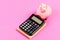 Piggy bank pink pig and calculator. Business administration. Finance manager job position. Trading exchange. Trade