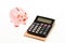 Piggy bank pink pig and calculator. Exchange rates. Economics and business administration. Credit debt concept. Piggy