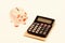 Piggy bank pink pig and calculator. Exchange rates. Economics and business administration. Credit debt concept. Piggy