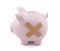 Piggy bank with plaster