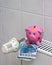 Piggy bank with radiator thermostat saving heating costs