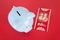 Piggy bank and red envelope on red background.The Chinese meaning in the picture is `happiness` and `lucky and happy`