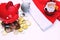 piggy Bank red pig near scattered Russian coins, the piggy Bank tilted in the direction of Santa Claus and the red cap.