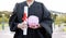 Piggy bank, saving and university diploma in hands of woman graduate with education scroll. Study paper, scholarship and