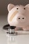 Piggy Bank and Stethoscope with Selective Focus