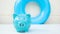 Piggy bank and swing rubber ring, saving money for retreat, vacation, lifestyle