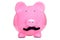 Piggy bank wearing a fake moustache