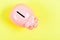 Piggy bank on yellow background. money saving. income management. financial problem. planning budget. copy space. Pay