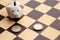 Piggy piggy bank and euro coins in the form of figures on a chessboard, business concept, games, close-up, copy space