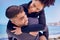 Piggyback, love and fitness couple at a beach for training, bond and morning workout in nature. Sports, workout and