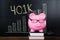 Piggybank In Front Of Blackboard