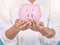 . Piggybank, future investment and money in hands of female bank manager doing finance planning. Closeup of an