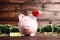 Piggybank with santa hat and beads