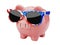 Piggybank with usa or america flag sunglasses isolated on white