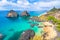 Pigs Bay beach (Baia dos Porcos) in Fernando de Noronha Island Brazil with Two Brothers Hill (Morro dois Irmaos)