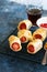 Pigs in a planket - puff pastry rolls with sausages on a wire rack