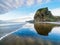 Piha Beach, Auckland, New Zealand with Lion Rock with reflections