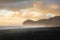 Piha beach at sunset with someone walking