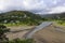 Piha black sand beach featuring cliffs and rock formations in New Zealand