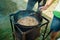 Pilaf Cooking in cauldron on fire outdoors series