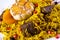 Pilaf with meat, dried fruits and garlic