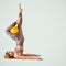 Pilates. Beautiful woman doing exercise with ball. Rack on the shoulder blades.