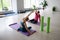 Pilates instructor and woman in sportswear in the gym perform body tilts.Rehabilitation after injury, posture correction