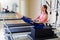 Pilates reformer woman short box teaser exercise