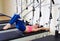 Pilates reformer woman short spine exercise