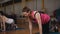 Pilates on a special Mat in the gym. Two women doing sports exercises on the floor.