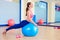 Pilates woman fitball swan exercise workout