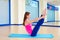 Pilates woman open leg rocker exercise workout