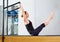 Pilates woman in reformer teaser exercise at gym