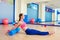 Pilates woman roller roll back exercise workout