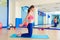 Pilates woman sand balls chest expansion exercise