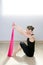 Pilates yoga resistance band red rubber gym woman