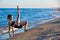 Pilates yoga workout exercise outdoor on beach