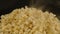 Pile of appetizing popcorn with dissipating steam. Freshly cooked hot popcorn. Close up. Concept of snack for movie.