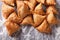 Pile of baking samosas on a floured table. horizontal top view