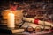 A pile of books, book, glasses, candle, origami, scroll on the wood desk