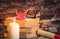 A pile of books, book, glasses, candle, origami, scroll on the wood desk