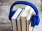 Pile of books with headphones. Close view