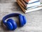 Pile of books with headphones on the table