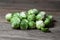 Pile of brussels sprouts on wooden table