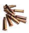 A pile bullet shells on a white background