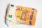 Pile bundle of euro bills money note on white background