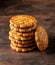 Pile of butter French biscuits on dark background.