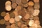 A pile of Canadian one cent coins and United States pennies