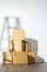 Pile of cardboard boxes on white background with Ladder shadow